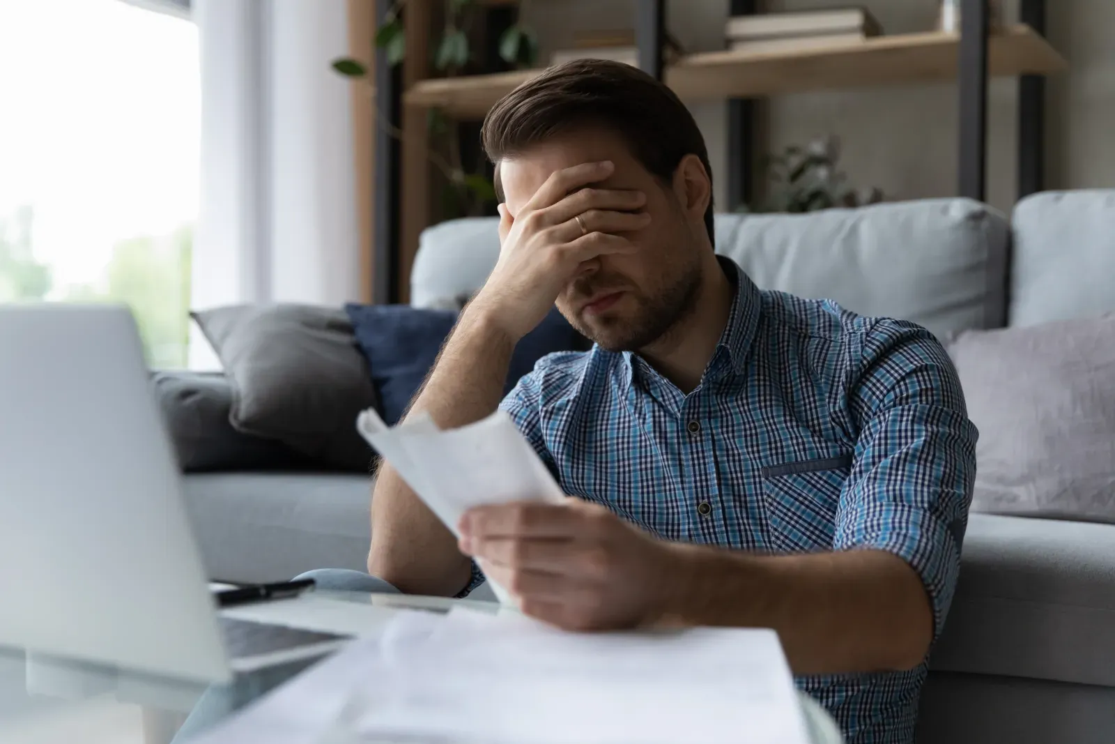 An Israeli business owner reviewing foreign currency exchange costs, representing hidden bank FX spreads on business transfers